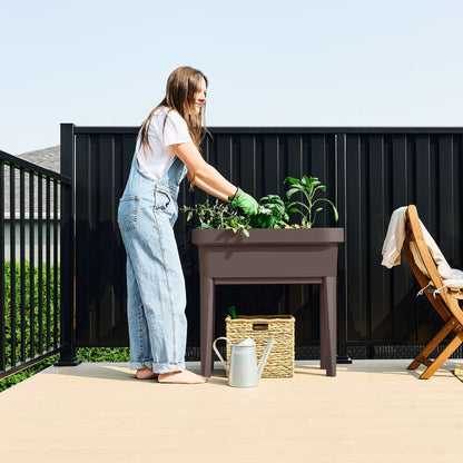 Raised garden bed with trellis and self-watering system